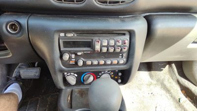 2000-2005 Pontiac Sunfire Trim Bezel Around Radio Surround Dash Panel Oem