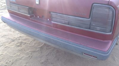 1990-1991 Olds Eighty Eight Tail Trim Panel Below Tail Lights Oem Red 25552895