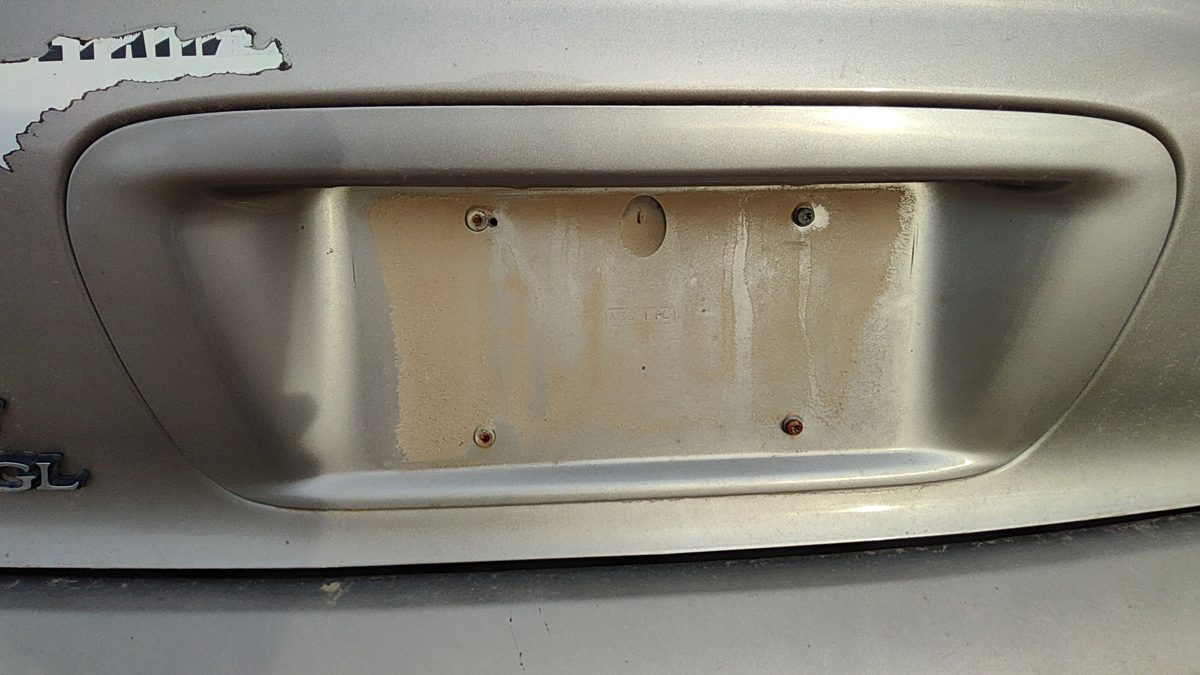 95-99 Contour License Plate Trim Surround Panel Tail Trunk Finish Dk Champagne