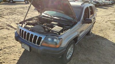 1999-2002 Jeep Grand Cherokee Driver Left Front Brake Caliper With Mount Bracket