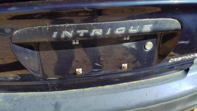 00 Oldsmobile Intrigue License Plate Trim Surround Panel Oem Tail Trunk Blue 28u