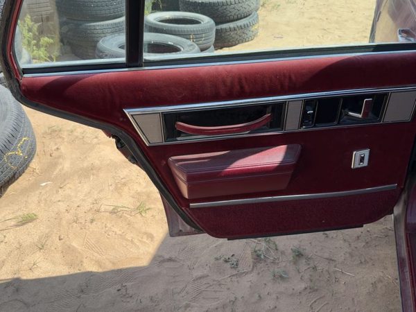 1986-1988 Olds 88 Driver Left Rear Door Trim Panel With Switches Back — photo 1