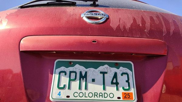 08-10 Nissan Rogue License Plate Trim Surround Panel Trunk Finish A33 Venom Red — photo 4