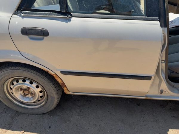 2000 Mazda Protege Rear Door RH Champagne Silver 4F — photo 1