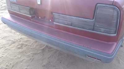1990-1991 Olds Eighty Eight Tail Trim Panel Below Tail Lights Oem Red 25552895