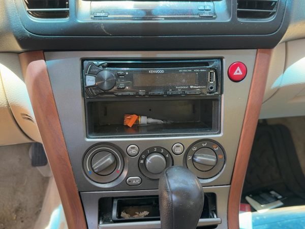 2005-2007 Subaru Legacy Outback Radio Trim Bezel Surround Taupe OEM 66040AG02A — photo 2