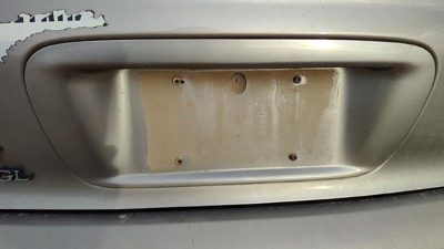 95-99 Contour License Plate Trim Surround Panel Tail Trunk Finish Dk Champagne