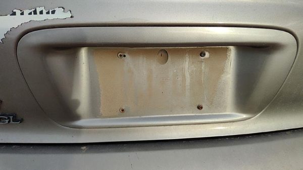 95-99 Contour License Plate Trim Surround Panel Tail Trunk Finish Dk Champagne — photo 1