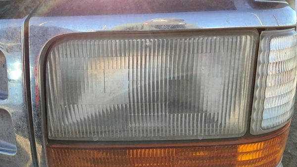 1995 Ford F150 Headlamp Assembly LH — photo 1