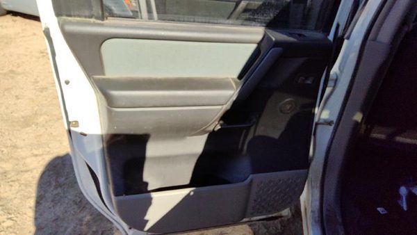 04-07 Titan Driver Left Rear Door Trim Panel With Switches Back W Graphite — photo 1