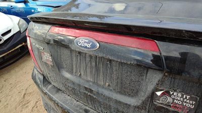 10-12 Ford Fusion License Plate Trim Surround With Third Brake Light Middle Lamp