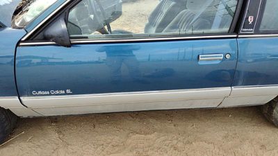 1989 Olds Calais Front Door LH Blue