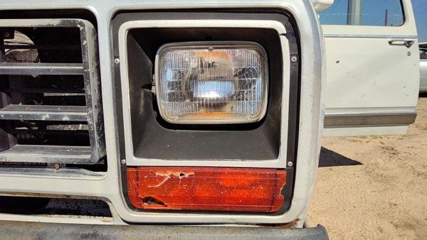 1984 Dodge D350 Headlight Door LH — photo 1