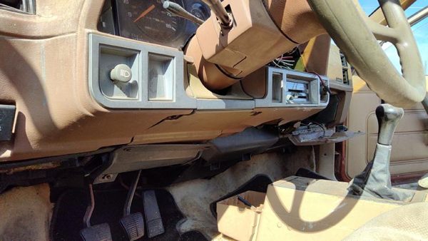 1985-1988 Pontiac Sunbird Lower Dash Under Column Knee Bolster Trim Panel Tan — photo 1