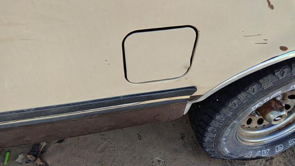1988 Ford F150 Fuel Tank Door Brown — photo 1