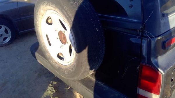 1996 Geo Tracker Rear Mounted Spare Tire Carrier Oem Bracket Assembly — photo 3