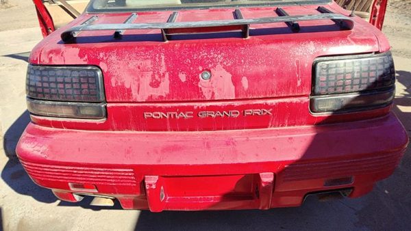 1988-1996 Grand Prix Rear Tail Panel Oem Trim Moulding Strip Red 2 Door 10102989 — photo 1