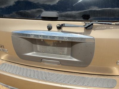 04-05 Rainier License Plate Trim Surround Panel Tail Trunk Finish Cashmere 15U