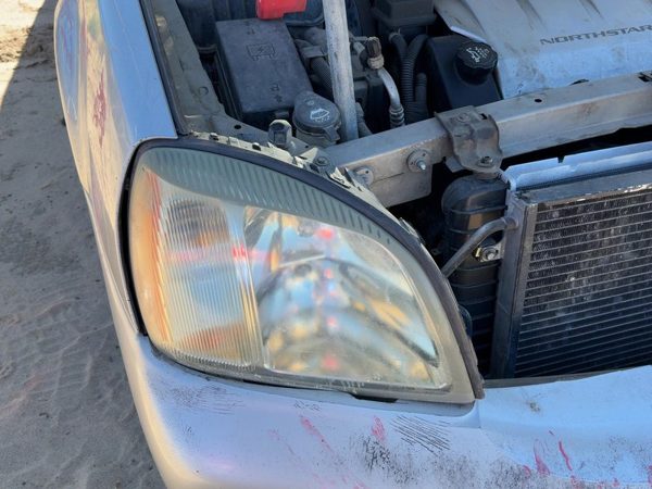 2005 Cadillac Deville Headlamp Assembly RH — photo 1