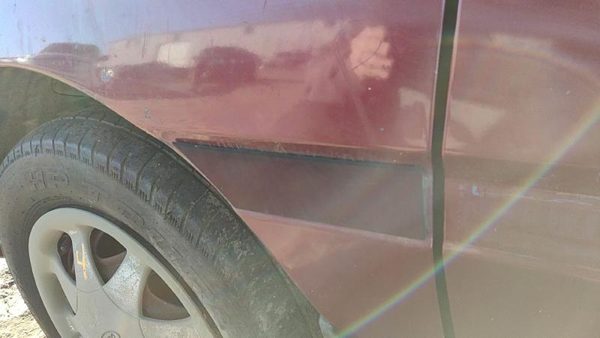 1997 Ford Aspire Fender Moulding LH E5 Red — photo 2