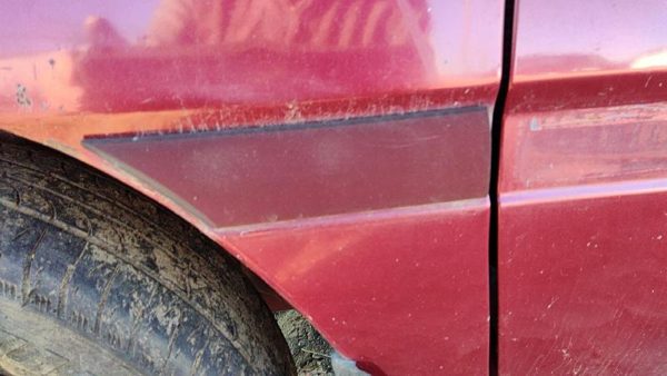 1997 Ford Aspire Fender Moulding LH E5 Red — photo 4