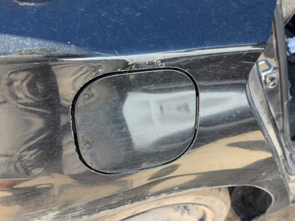2014 Nissan Sentra Fuel Tank Door Super Black KH3 — photo 2