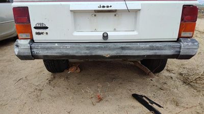 1984-1996 Jeep Cherokee Rear Bumper Assembly With Brackets Oem
